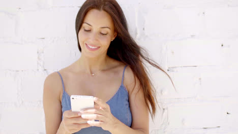 Pretty-young-woman-checking-a-text-message