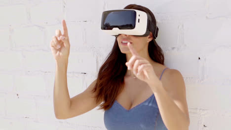 Young-woman-wearing-virtual-reality-goggles