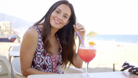 Gorgeous-young-woman-enjoying-a-cocktail