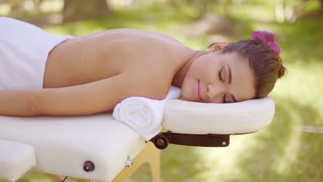 Young-woman-enjoying-an-outdoor-spa-treatment