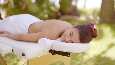Young-woman-enjoying-an-outdoor-spa-treatment