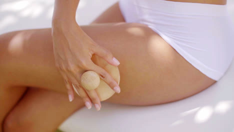 Close-up-of-woman-using-massage-tool