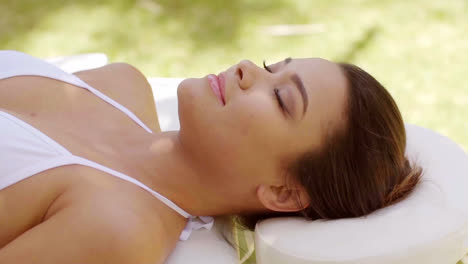 Single-woman-laying-down-in-outdoor-beauty-spa