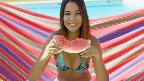 Pretty-young-woman-holding-eaten-watermelon