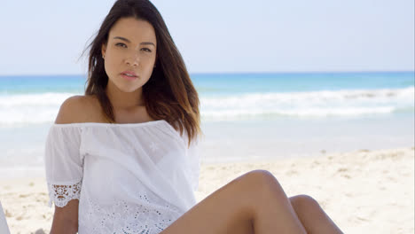 Gorgeous-young-woman-relaxing-on-the-beach