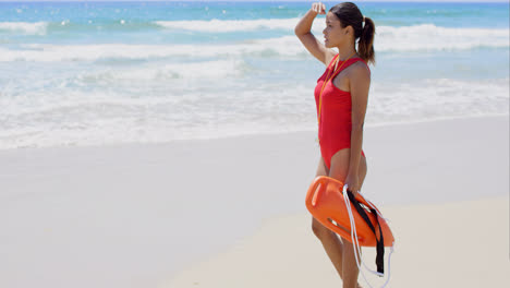 Side-view-on-woman-in-red-with-buoy