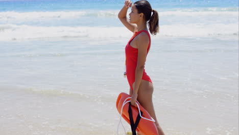 Side-view-on-woman-in-red-with-buoy