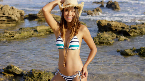 Sexy-young-woman-in-a-straw-hat-and-bikini
