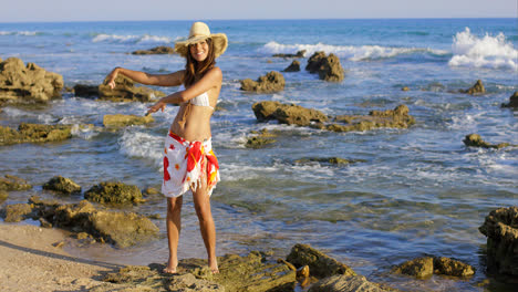 Woman-hula-dancing-on-seaweed-covered-surf