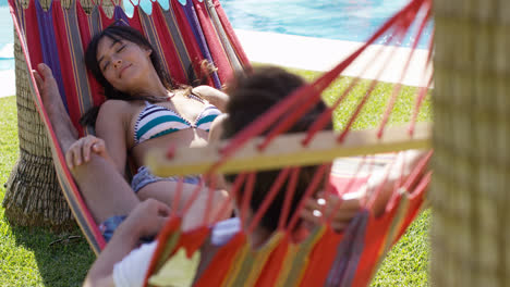 Young-holiday-couple-relaxing-in-a-hammock
