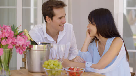Attractive-mixed-couple-having-wine-together