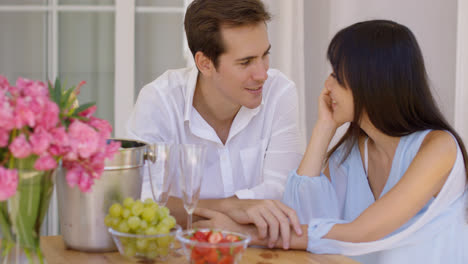 Attractive-mixed-couple-having-wine-together