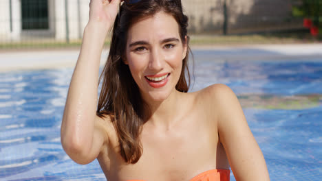 Attractive-trendy-young-woman-in-a-swimming-pool