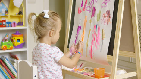 Artistic-little-girl-painting-a-creative-design