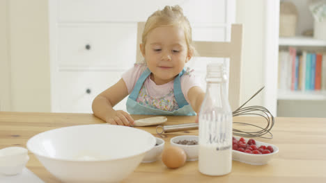 Cute-baby-baking-in-a-kitchen