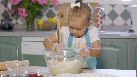 Pretty-little-girl-baking-a-homemade-tart