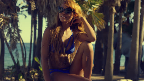 Pretty-African-Woman-in-Bikini-Sitting-on-Bench