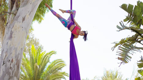 Exotic-acrobatic-dancer-working-out-on-silk-ribbon