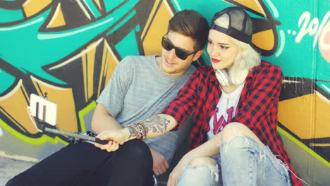 Trendy-young-hipster-couple-taking-a-selfie