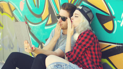 Hipster-young-couple-having-a-video-chat