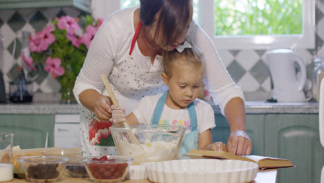 Little-girl-helping-her-Mum-with-the-baking