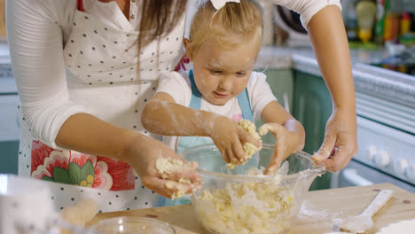 Cute-little-girl-kneading-baking-ingredients