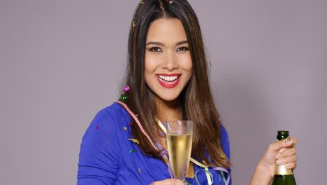 Gorgeous-young-woman-celebrating-with-champagne