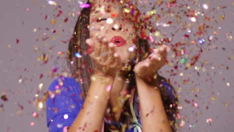 Cute-young-woman-blowing-confetti