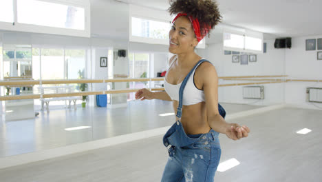 Attractive-female-dance-student-smiles-at-camera