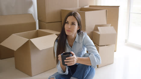 Thoughtful-young-woman-contemplating-her-new-house
