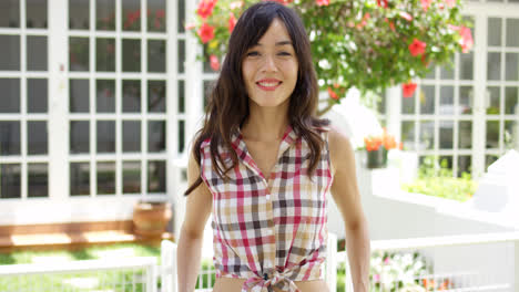 Cute-Asian-woman-in-tied-plaid-shirt
