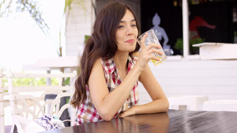 Pretty-young-woman-enjoying-a-cold-drink