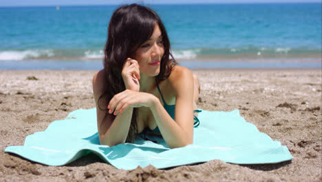 Pretty-woman-sunbathing-on-a-tropical-beach
