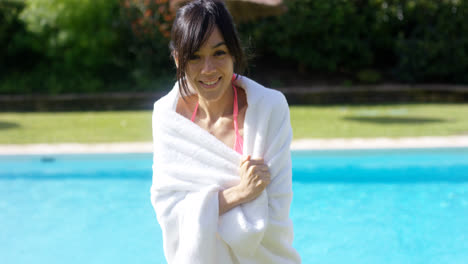 Pretty-friendly-young-woman-wrapped-in-a-towel
