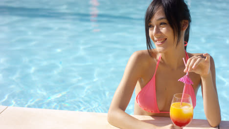 Happy-gorgeous-young-woman-in-a-summer-pool