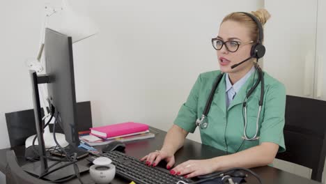 Medical-practitioner-using-computer-during-online-meeting