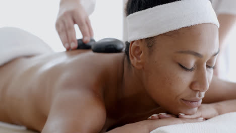 Woman-Receiving-A-Massage-With-Hot-Stone