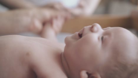 pediatrician-flexes-and-stretches-adorable-infant-boy-arms