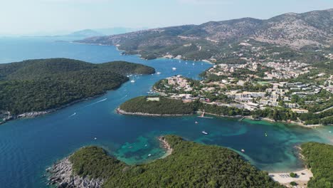 Syvota-Coastal-Village-with-Green-Islands,-Beaches-and-Holiday-Resorts-at-Epirus,-Greece---Aerial
