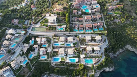 Holiday-Resort-Hotel-with-swimming-pool-villa's-at-Syvota,-Epirus,-Greece---Aerial-Birdseye