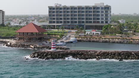 Hilton-Garden-Inn-La-Romana,-Beachfront-Hotel-In-Dominican-Republic---aerial-drone-shot