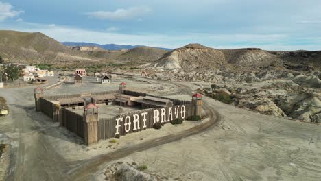 Fort-Bravo-Western-Theme-Park-in-Tabernas-Desert,-Almeria,-Andalusia,-Spain---Aerial-Circling