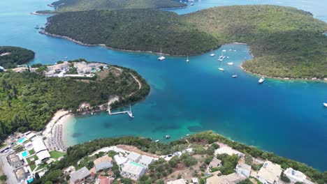 Syvota-Coastal-Village-with-Green-Islands,-Beach-and-Holiday-Resorts-at-Epirus,-Greece---Aerial
