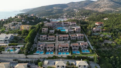 Holiday-Resort-Hotel-with-swimming-pool-villa's-at-Syvota,-Epirus,-Greece---Aerial
