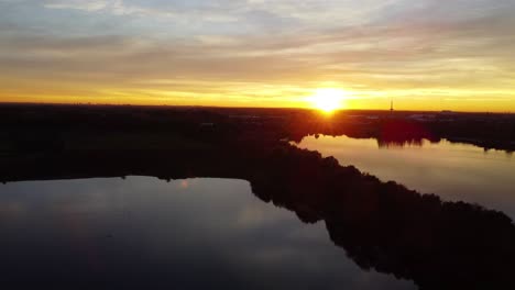Pan-over-the-silhouetted-horizon-of-Mechels-Broek-from-a-drone