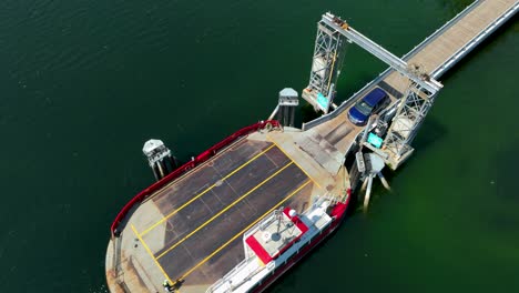 Aerial-view-of-a-car-being-loaded-onto-a-private-ferry-serving-the-Herron-Island-community