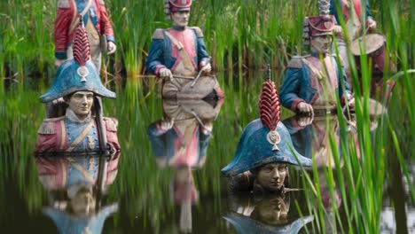 Soldiers-of-Napoleon-in-park-pond,-static-view