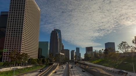 Day-Timelapse-Of-Cars-On-Highway-And-Clouds-At-Sky-In-The-City-Of-Los-Angeles-In-California,-United-States