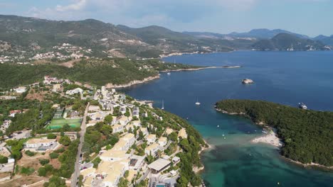 Syvota-scenic-coastline,-island-and-sandy-beach-in-Epirus,-Greece---Aerial