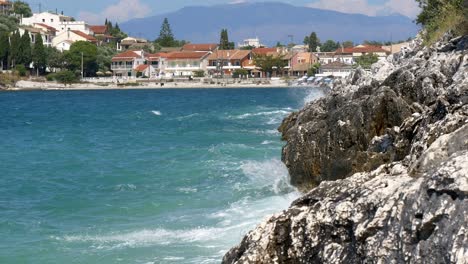 Foamy-waves-of-the-Ionian-Sea-crash-against-a-rocky-cliff-on-Corfu-Island